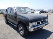 It is a picture of the black 2 nissan datsun truck in 1993,First Photo Stock No.Y016439