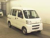 It is a picture of the white daihatsu hijet  deck van in 2006,First Photo Stock No.Y016950