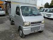 It is a picture of the silver suzuki carry  truck in 2002,First Photo Stock No.Y017196