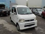 It is a picture of the white daihatsu hijet  deck van in 2002,First Photo Stock No.Y017199