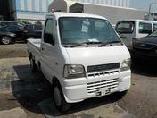 It is a picture of the white suzuki carry truck in 2002,First Photo Stock No.Y017324