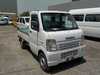 It is a picture of the white suzuki carry truck in 2004,Sub Photo 0 Stock No.Y017527