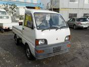 It is a picture of the white mitsubishi minicab truck in 1994,First Photo Stock No.Y020751