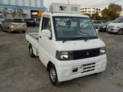 It is a picture of the white mitsubishi minicab truck in 2003,First Photo Stock No.Y020966