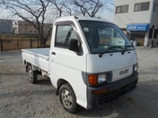 It is a picture of the white daihatsu hijet truck in 1997,First Photo Stock No.Y021345