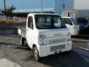 It is a picture of the white suzuki carry  truck in 2003,First Photo Stock No.Y021737