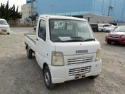 It is a picture of the white suzuki carry truck in 2003,First Photo Stock No.Y021879
