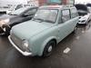 It is a picture of the olive nissan pao open top in 1989,Sub Photo 1 Stock No.Y022101