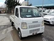It is a picture of the white suzuki carry truck in 2003,First Photo Stock No.Y022470