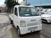 It is a picture of the white suzuki carry truck in 2003,Sub Photo 0 Stock No.Y022470