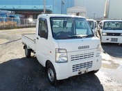 It is a picture of the white suzuki carry truck in 2006,First Photo Stock No.Y022478