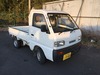 It is a picture of the white suzuki carry truck in 1993,Sub Photo 0 Stock No.Y022966