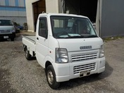 It is a picture of the white suzuki carry truck in 2003,First Photo Stock No.Y023364