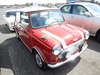 It is a picture of the red 2 rover mini in 1992,Sub Photo 0 Stock No.Y023365