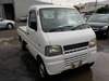 It is a picture of the white suzuki carry truck in 2001,Sub Photo 0 Stock No.Y025086