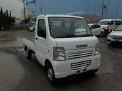 It is a picture of the white suzuki carry truck in 2006,First Photo Stock No.Y025098