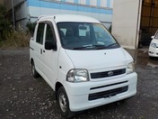 It is a picture of the white daihatsu hijet  deck van in 2004,First Photo Stock No.Y026484
