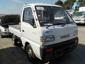 It is a picture of the white suzuki carry truck in 1992,First Photo Stock No.Y026857
