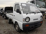 It is a picture of the white suzuki carry  truck in 1993,First Photo Stock No.Y027370