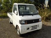 It is a picture of the white mitsubishi minicab truck in 2003,First Photo Stock No.Y027625