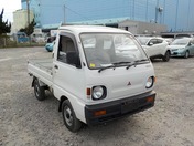 It is a picture of the white mitsubishi minicab truck in 1993,First Photo Stock No.Y027689