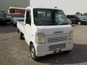 It is a picture of the white suzuki carry truck in 2003,First Photo Stock No.Y027924