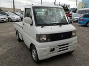 It is a picture of the white mitsubishi minicab truck in 2002,First Photo Stock No.Y028113