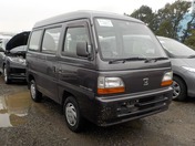 It is a picture of the gunmetal honda acty passenger van in 1995,First Photo Stock No.Y028340