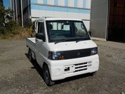 It is a picture of the white mitsubishi minicab truck in 2006,First Photo Stock No.Y030216