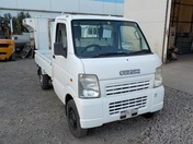 It is a picture of the white suzuki carry truck in 2006,First Photo Stock No.Y030422