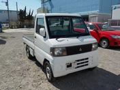 It is a picture of the white mitsubishi minicab truck in 2002,First Photo Stock No.Y030632