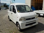 It is a picture of the white daihatsu hijet deck van in 2002,First Photo Stock No.Y031011