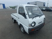 It is a picture of the white suzuki carry truck in 1993,First Photo Stock No.Y031675