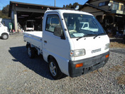 It is a picture of the white suzuki carry dump in 1996,First Photo Stock No.Y031981
