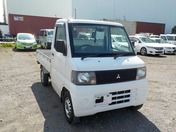 It is a picture of the white mitsubishi minicab truck in 2001,First Photo Stock No.Y032198