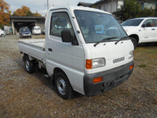 It is a picture of the white suzuki carry truck in 1996,First Photo Stock No.Y038110