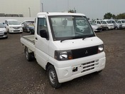 It is a picture of the white mitsubishi minicab truck in 2004,First Photo Stock No.Y032411