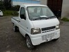 It is a picture of the white suzuki carry truck in 2002,Sub Photo 1 Stock No.Y032461