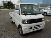 It is a picture of the white mitsubishi minicab truck in 2004,First Photo Stock No.Y032465