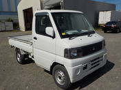 It is a picture of the white mitsubishi minicab truck in 2005,First Photo Stock No.Y032873