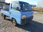 It is a picture of the blue honda acty truck in 1996,First Photo Stock No.Y033307