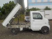 It is a picture of the white suzuki carry dump in 2010,First Photo Stock No.Y033569