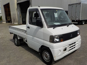 It is a picture of the white mitsubishi minicab  truck in 2002,First Photo Stock No.Y033664