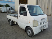 It is a picture of the white suzuki carry truck in 2002,First Photo Stock No.Y034214