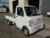 It is a picture of the white suzuki carry truck in 2003,Sub Photo 0 Stock No.Y034315