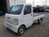 It is a picture of the white suzuki carry truck in 2003,Sub Photo 1 Stock No.Y034423