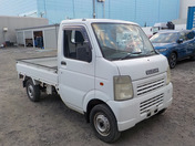 It is a picture of the white suzuki carry truck in 2003,First Photo Stock No.Y034423