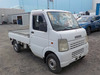 It is a picture of the white suzuki carry truck in 2003,Sub Photo 0 Stock No.Y034423