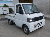 It is a picture of the white mitsubishi minicab truck in 2001,First Photo Stock No.Y034674