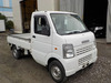 It is a picture of the white suzuki carry truck in 2006,Sub Photo 0 Stock No.Y034867